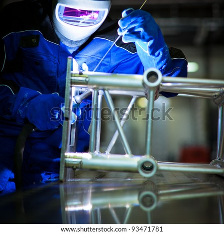 WELDER AT WORK (color toned image; shalow DOF)