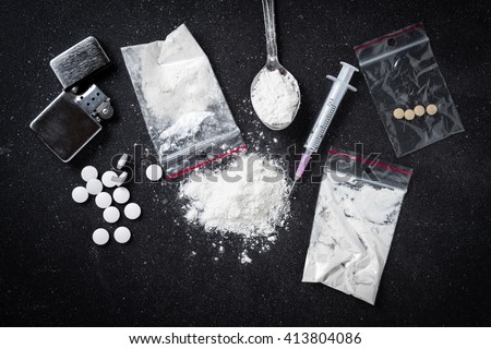Hard drugs on dark table