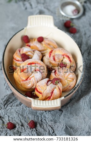 Homemade buns with raspberry jam. Sweet homemade Christmas baking. Winter decor. Winter, Christmas, New Year's still life. Cozy food.