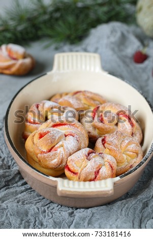 Homemade buns with raspberry jam. Sweet homemade Christmas baking. Winter decor. Winter, Christmas, New Year's still life. Cozy food.