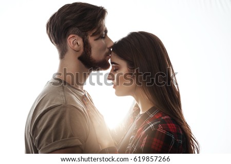 https://thumb9.shutterstock.com/display_pic_with_logo/2967241/619857266/stock-photo-tender-picture-of-young-couple-man-kissing-woman-to-forehead-619857266.jpg