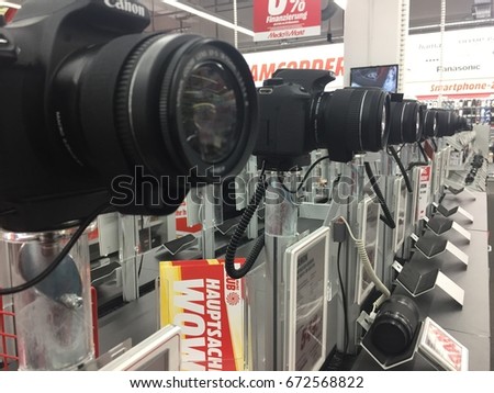 Berlin, Germany - May 6, 2017: Canon cameras in MediaMarkt store. That is a Japanese multinational corporation manufacturing imaging and optical products, including cameras, and computer printers