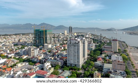 Da Nang, Vietnam - May 24, 2016: Business and Administrative District of Da Nang city on the Han riverbank, with Thuan Phuoc Bridge. Picture taken on May 24, 2016