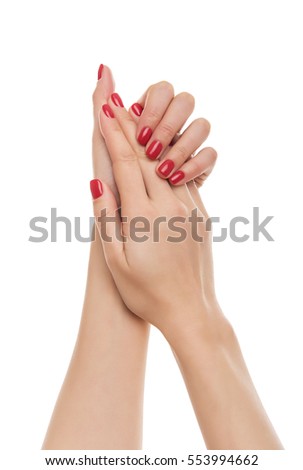 Beautiful female hands isolated on a white background