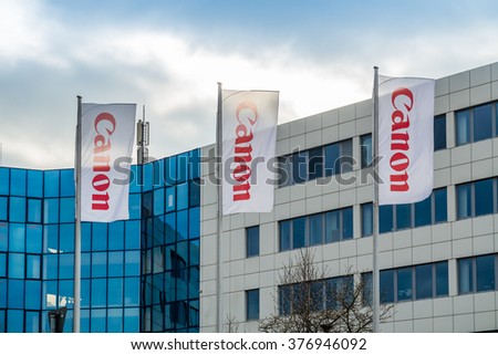 KREFELD / GERMANY - FEBRUARY 15 2016 : Canon office building with company flags in the foreground