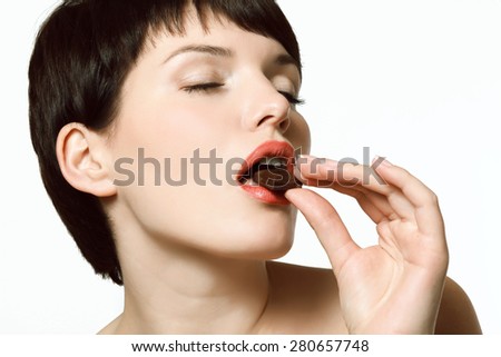 Sexy girl eating chocolate