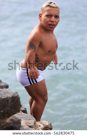 stock-photo-salvador-bahia-brazil-dec-celebrity-midget-diving-and-swimming-at-porto-da-barra-562830475.jpg
