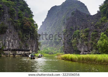 NINHBINH, VIETNAM - May 17, 2015: Unidentified people tourist at "Ngo Dong" river in Tam Coc Bich Dong heritage, Ninh Binh province, Vietnam.