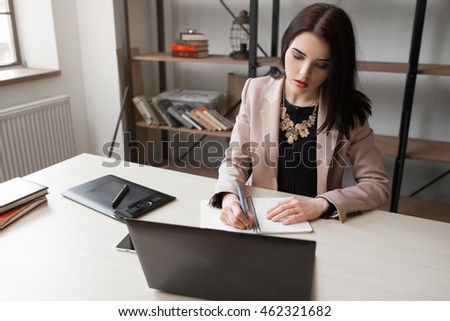 Female cartoonist drawing at office. Creative woman illustrator designing new sketch