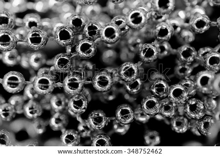 Golden pearl necklace macro abstract background black and white