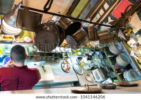 The working process of the chef cook on the kitchen of a modern seafood restaurant