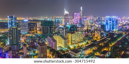 Ho Chi Minh City, Vietnam - August 6th, 2015: Drawing beautiful urban architecture, impressive multicolored light from the darkness down in District 1, Ho Chi Minh City, Vietnam