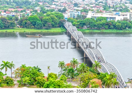 In Hue, Vietnam - June 21st, 2015: Trang Tien Bridge double appeal connecting the waterfront with boat passing Perfume giving Poetic painting Hue in Hue, Vietnam