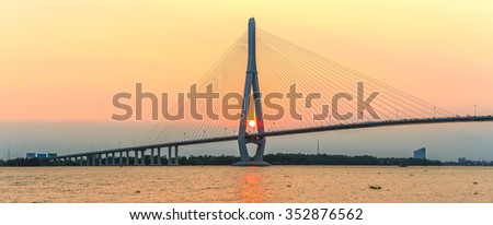 Can Tho, Vietnam - April 4th, 2015: Beauties of cable stayed bridge at sunset with the sun in the abutment expressed shining achievements of human development in rural Mekong Delta in Can Tho, Vietnam