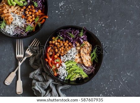 Gesundheit  Stock-photo-grilled-chicken-rice-spicy-chickpeas-avocado-cabbage-pepper-buddha-bowl-on-dark-background-587607935
