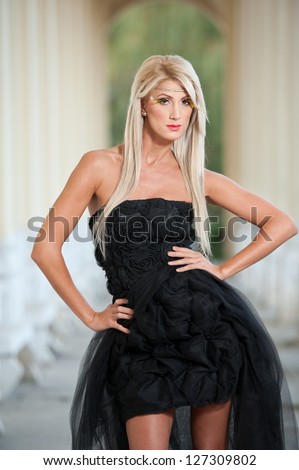 https://thumb9.shutterstock.com/display_pic_with_logo/315760/127309802/stock-photo-beautiful-woman-in-black-dress-posing-outdoor-sexy-woman-in-stylish-retro-scene-elegant-woman-in-127309802.jpg
