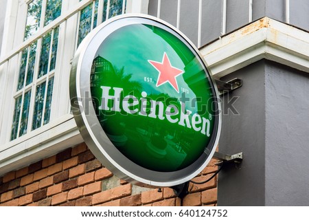 Pickadaily, Bangkok, Thailand. - May 14, 2017 : Heineken logo hang on the wall building.