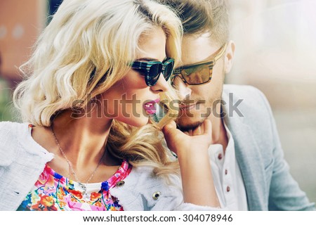 Happy fashionable couple in the city