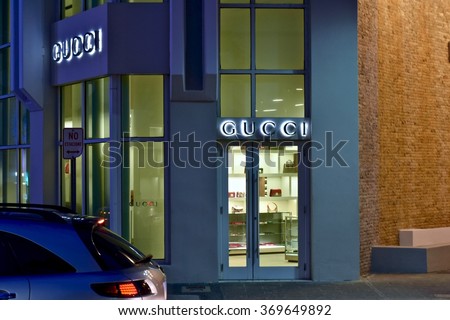 CONDADO, PUERTO RICO - JANUARY 24, 2016: The Gucci store front in Condado at night. Gucci is an Italian fashion and leather goods brand.