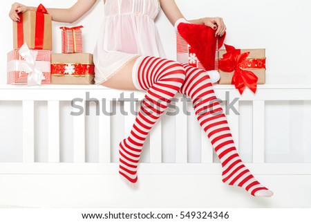 sexy woman in lingerie and sexy santa stockings with gifts and christmas caps xmas - Santa Stockings sexy woman in lingerie and sexy santa stockings with gifts and christmas caps xmas - Santa Stockings