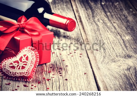 St Valentine's setting with present and red wine