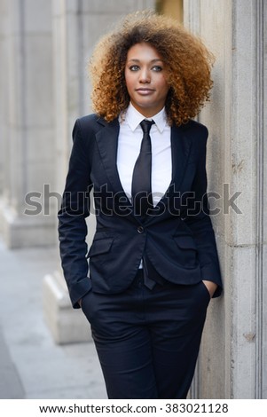 https://thumb9.shutterstock.com/display_pic_with_logo/336115/383021128/stock-photo-portrait-of-beautiful-black-businesswoman-wearing-suit-and-tie-in-urban-background-model-of-383021128.jpg