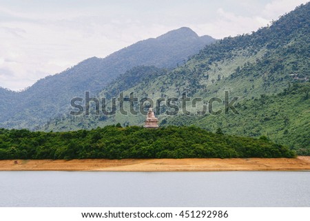 HUE, VIETNAM - CIRCA AUGUST 2013: Buddha statue of Truc Lam Bach Ma Buddhist Temple in the middle of Truoi Lake in Hue (Vietnam)
