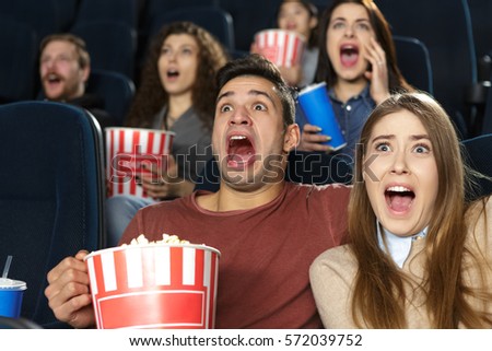 https://thumb9.shutterstock.com/display_pic_with_logo/3437759/572039752/stock-photo-time-for-some-scare-young-couple-watching-a-horror-movie-together-at-the-cinema-embracing-and-572039752.jpg