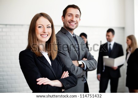 Group of business people with female leader in foreground