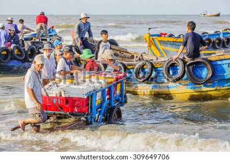 VUNG TAU, VIETNAM - AUG 23,2015: Fishermen on beach at the Fishing Village Long Hai, Vietnam.