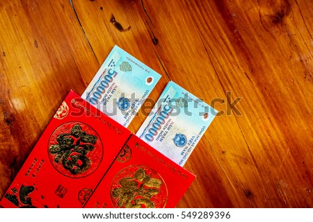 Habit, custom of Vietnamese on Tet is lucky money, a Vietnam traditional culture, child wish somebody a happy new year, receive red envelope with new small change, Tet on spring, also lunar new year