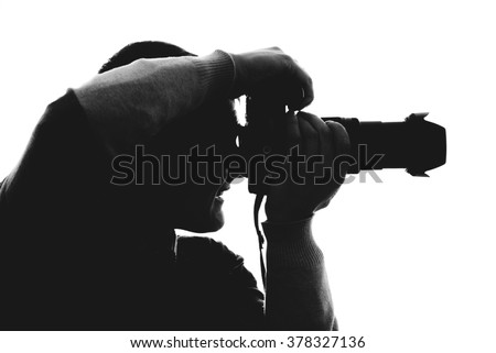 Photographer silhouette isolated on white background