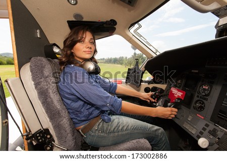 https://thumb9.shutterstock.com/display_pic_with_logo/351946/173002886/stock-photo-the-young-beautifu-women-is-a-pilot-the-small-plane-173002886.jpg