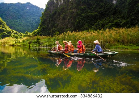 Ninh Binh, Vietnam Otc 29,2015: Tourist in Trang An- Tam Coc, Vetnam. Trang An is UNESCO World Heritage Site, renowned for its boat cave tours. It's Halong Bay on land of Vietnam
