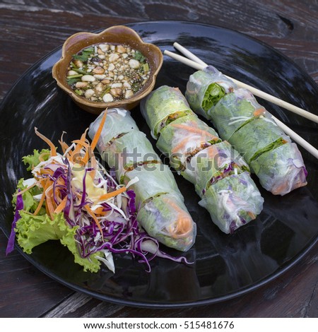 Fresh vietnamese spring rolls on a plate with salad