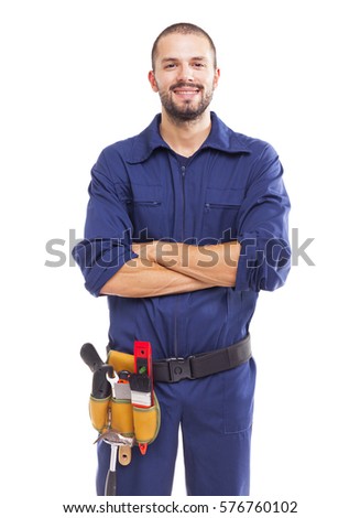 Portrait of a young worker smiling with arms crossed, isolated on white backround