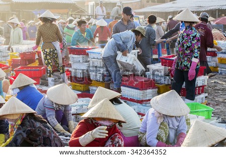VUNG TAU, VIETNAM - AUG 22,2015: Fishermen on beach at the Fishing Village Long Hai, Vietnam