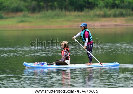 Stand up paddle boards (SUP) offer a fun, relaxing way to play on the water, Cam Son Lake, Bac Giang, Viet Nam 2016