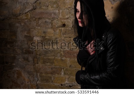Drug addiction concept. Drug addict posing near brick wall and having breaking in body. Drug abuse concept.