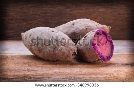 Purple Sweet Potatoes on a wooden table