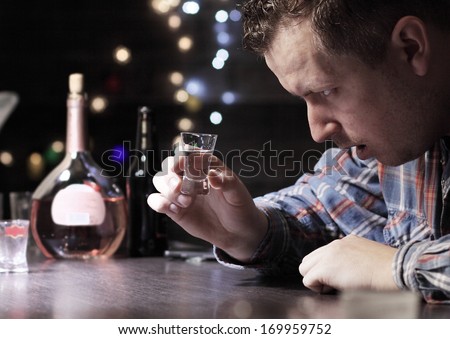 stock-photo-drunk-man-drinking-vodka-at-