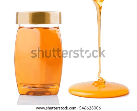 Honey pouring and honey bottle isolated on white background