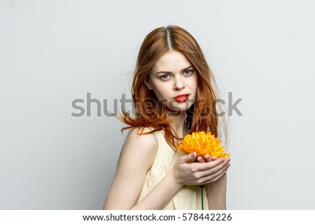 https://thumb9.shutterstock.com/display_pic_with_logo/3671573/578442226/stock-photo-woman-holding-flower-looking-the-camera-578442226.jpg