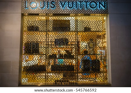 LONDON, UK - DECEMBER 12, 2016: A close-up of a Louis Vuitton symbol and shop display at their store on New Bond Street in London