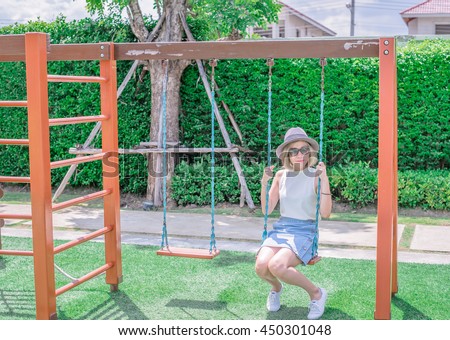 Attractive Young Asian Girl Wear Jean Sitting On Wooden Swing Swing Set Of Chain Swings Attractive Young Asian Girl Wear Jean Sitting On Wooden Swing Swing Set Of Chain Swings