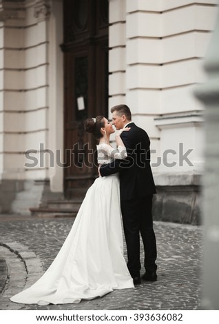 https://thumb9.shutterstock.com/display_pic_with_logo/3823586/393636082/stock-photo-luxury-married-wedding-couple-bride-and-groom-posing-in-old-city-393636082.jpg