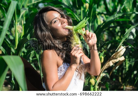 stock-photo-girl-asian-girl-eats-corn-on-the-field-the-hot-summer-day-the-hard-work-of-migrant-workers-698662222.jpg