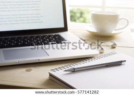 Pen and notebook with laptop.Inspiration moment,workspace or coffee break in the morning/ selective focus