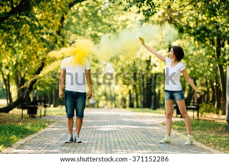 https://thumb9.shutterstock.com/display_pic_with_logo/3847352/371152286/stock-photo-young-and-beautiful-hipster-couple-funny-playing-in-the-park-on-holi-color-festival-with-colour-371152286.jpg