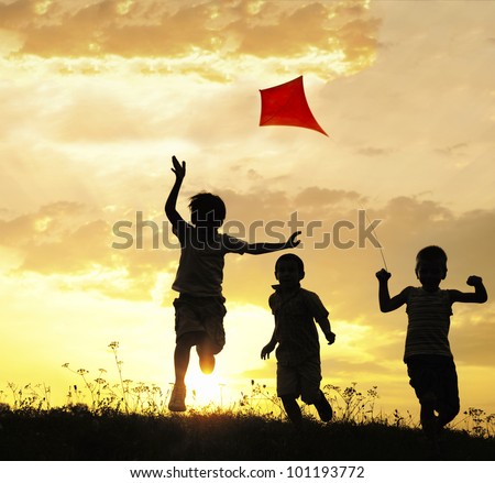 Children running with kite